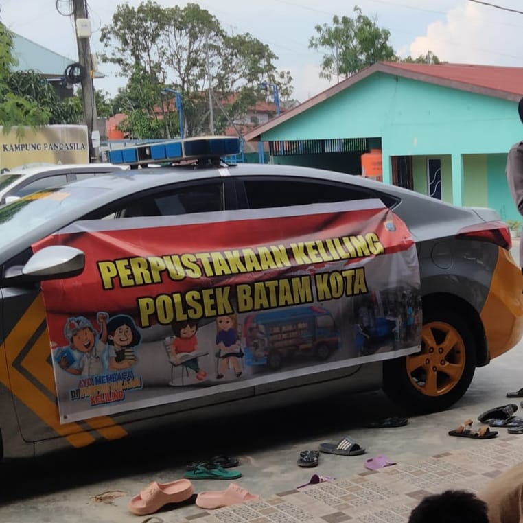 Polsek Batam Kota Gelar Pustaka Keliling Untuk Anak Anak di Perkampungan
